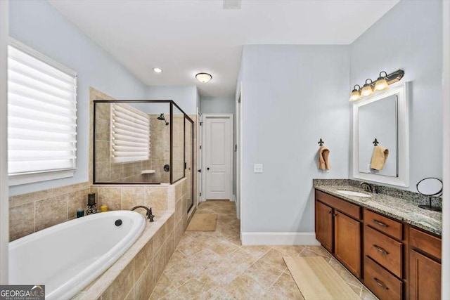 2358 New Salem Trce, Marietta, GA 30064 - full bath featuring a garden tub, a shower stall, vanity, and baseboards