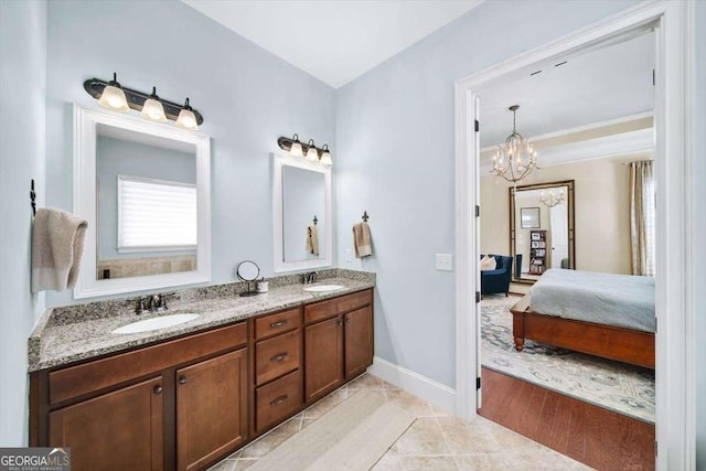 2358 New Salem Trce, Marietta, GA 30064 - ensuite bathroom with double vanity, a chandelier, and baseboards