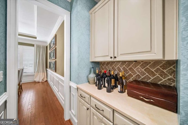 2358 New Salem Trce, Marietta, GA 30064 - bar featuring hardwood / wood-style flooring, a decorative wall, a wainscoted wall, and crown molding
