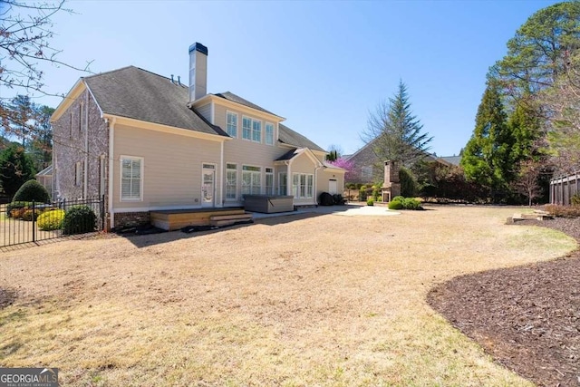 2358 New Salem Trce, Marietta, GA 30064 - back of house featuring fence, a wooden deck, and a chimney
