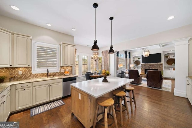 2358 New Salem Trce, Marietta, GA 30064 - kitchen featuring stainless steel dishwasher, a sink, open floor plan, a kitchen breakfast bar, and a center island