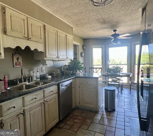 kitchen featuring dishwasher, a sink, ceiling fan, a peninsula, and a textured ceiling