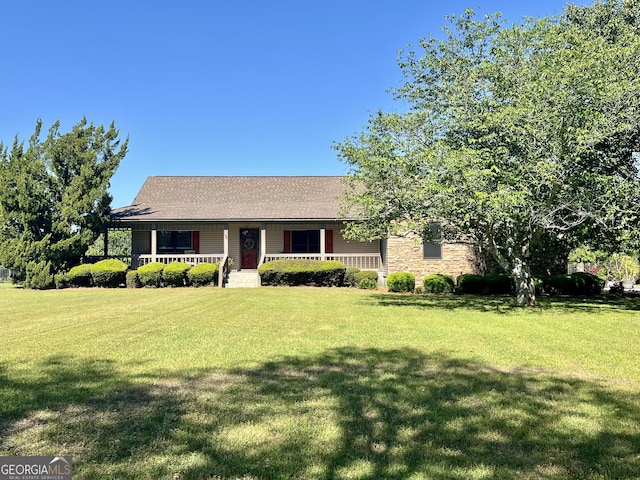ranch-style house featuring a porch and a front lawn
