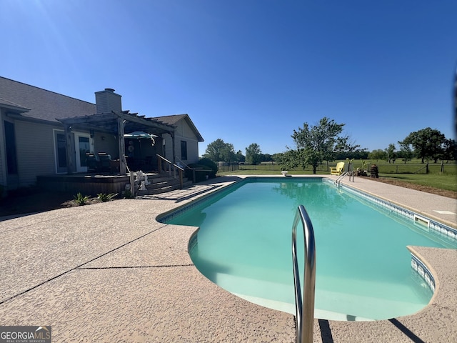 view of pool with a fenced in pool, fence private yard, a pergola, a patio area, and a wooden deck