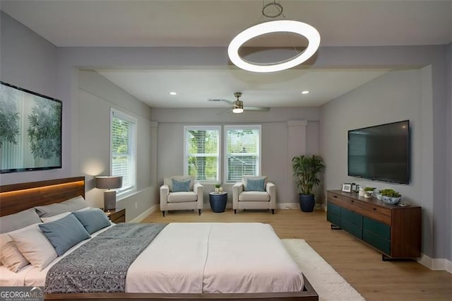 bedroom featuring light wood-style flooring, baseboards, and recessed lighting
