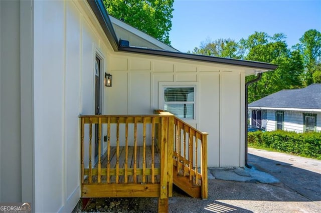 view of exterior entry with board and batten siding