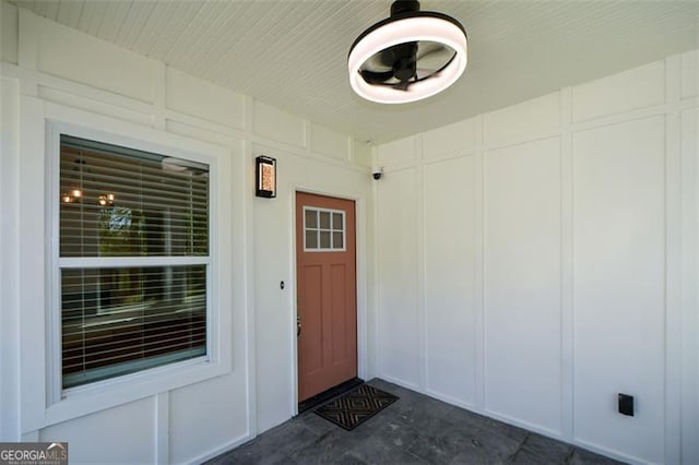 doorway to property featuring board and batten siding