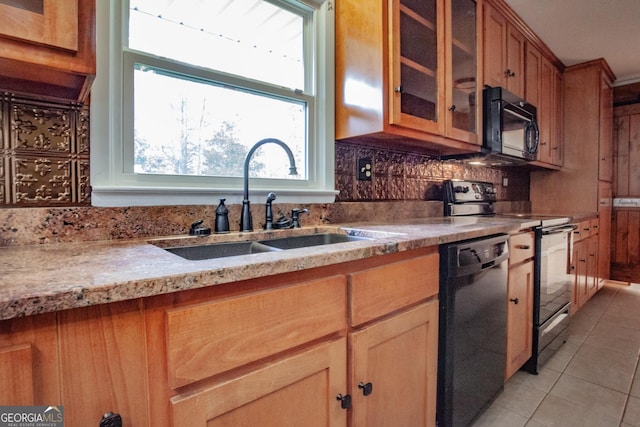 724 Ga Highway 120, Tallapoosa, GA 30176 - kitchen with black appliances, light tile patterned floors, tasteful backsplash, glass insert cabinets, and brown cabinets
