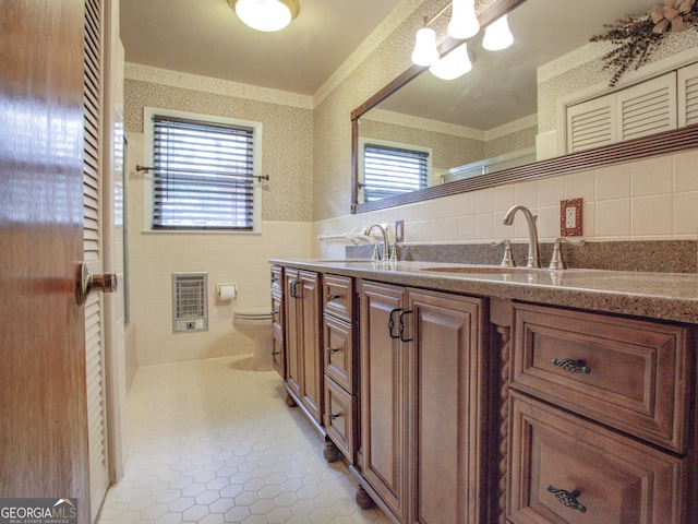 724 Ga Highway 120, Tallapoosa, GA 30176 - full bath featuring tile walls, heating unit, vanity, tile patterned flooring, and a wainscoted wall
