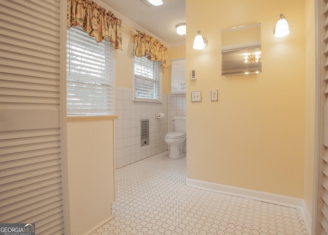 724 Ga Highway 120, Tallapoosa, GA 30176 - bathroom with heating unit, ornamental molding, tile walls, and tile patterned flooring