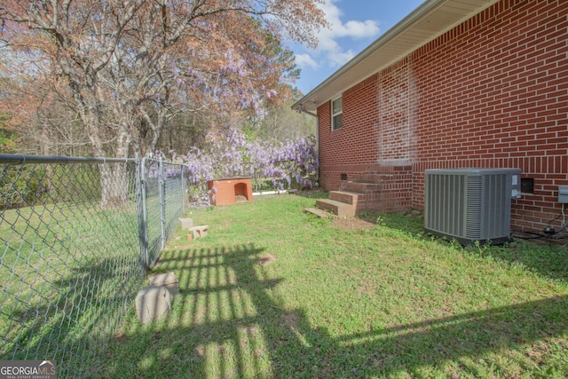 view of yard with cooling unit and fence