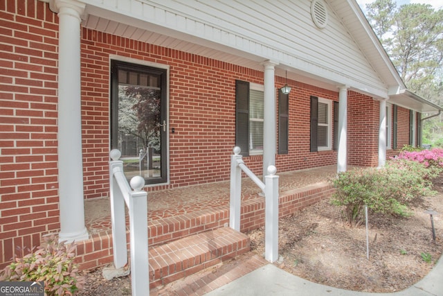 724 Ga Highway 120, Tallapoosa, GA 30176 - property entrance with a porch and brick siding