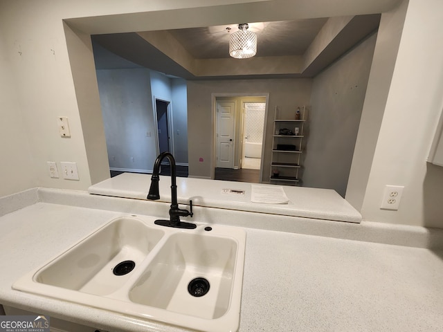 220 Renaissance Pkwy NE Apt 2220, Atlanta, GA 30308 - kitchen featuring a sink and a tray ceiling