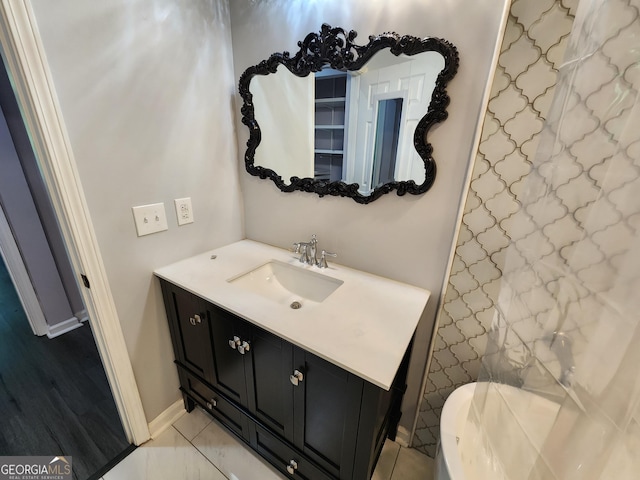 220 Renaissance Pkwy NE Apt 2220, Atlanta, GA 30308 - bathroom featuring vanity and baseboards