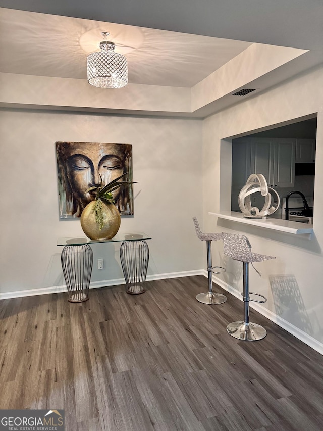 220 Renaissance Pkwy NE Apt 2220, Atlanta, GA 30308 - unfurnished dining area with wood finished floors and baseboards