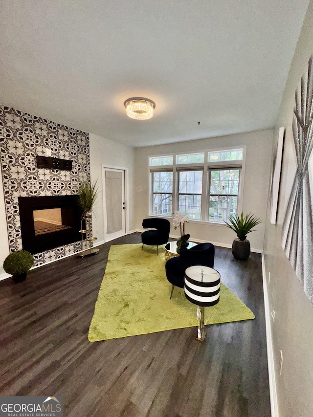 220 Renaissance Pkwy NE Apt 2220, Atlanta, GA 30308 - living room with wood finished floors, a fireplace, and baseboards