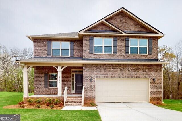 221 Shoreline Way Unit A016, Macon, GA 31220 - craftsman-style house featuring a garage, covered porch, brick siding, and a front lawn