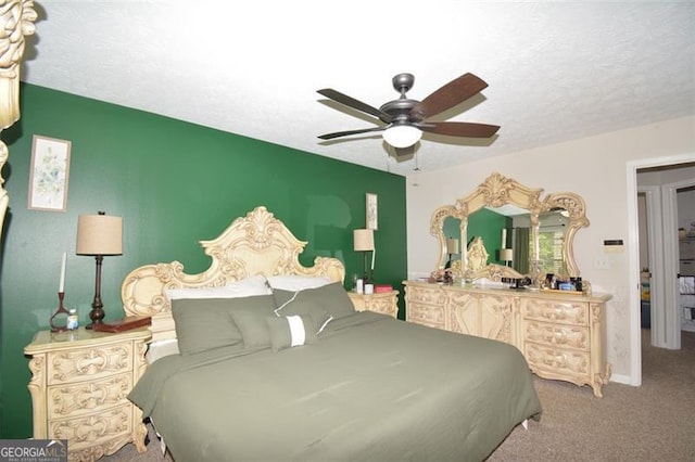 bedroom with a ceiling fan and carpet