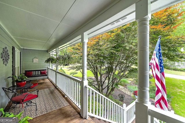 balcony featuring a porch