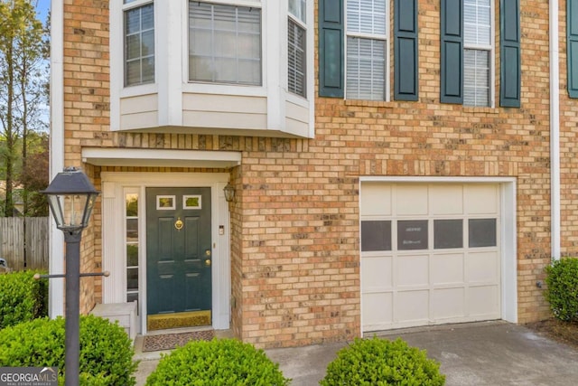 4366 Thorngate Ln, Acworth, GA 30101 - property entrance with a garage, brick siding, fence, and concrete driveway