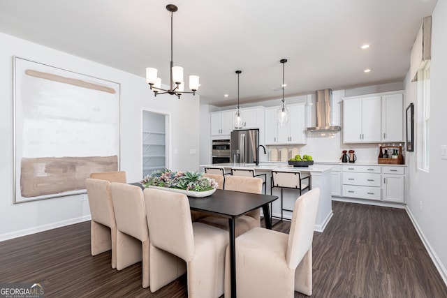 dining room featuring recessed lighting, dark wood finished floors, baseboards, and an inviting chandelier