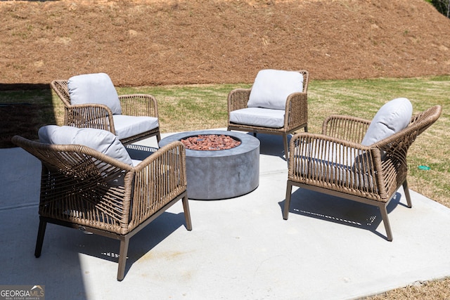 view of patio with a fire pit