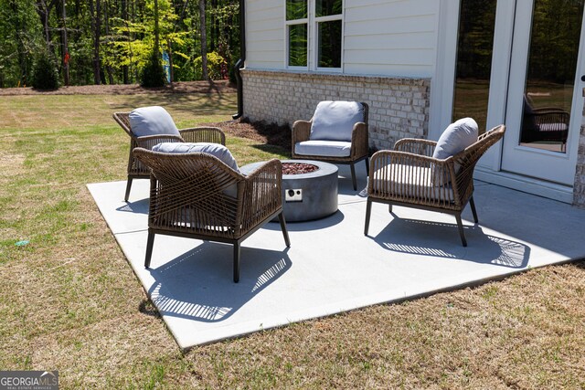 view of patio with an outdoor fire pit