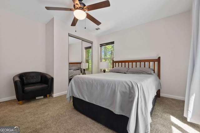 3690 Asbury Ln SW, Atlanta, GA 30331 - carpeted bedroom with ceiling fan and a closet