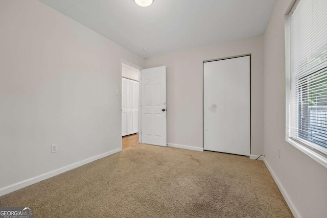 3690 Asbury Ln SW, Atlanta, GA 30331 - unfurnished bedroom with carpet and a closet