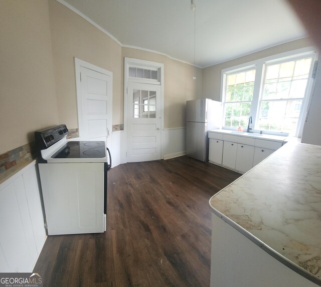 4 I Ave, Gainesville, GA 30504 - kitchen featuring washer / clothes dryer, white appliances, white cabinetry, crown molding, and dark wood-type flooring