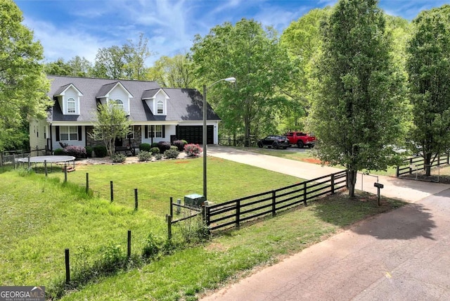 1055 River Bluff Dr, Winder, GA 30680 - view of front of house featuring a front lawn, a garage, driveway, and a fenced front yard