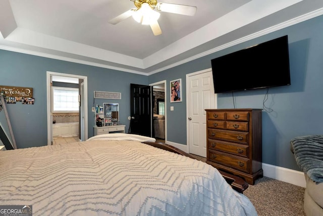 1055 River Bluff Dr, Winder, GA 30680 - bedroom featuring a tray ceiling, baseboards, a ceiling fan, and carpet flooring