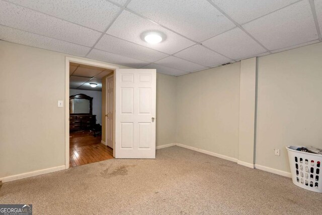 1055 River Bluff Dr, Winder, GA 30680 - finished below grade area with baseboards, a drop ceiling, and carpet