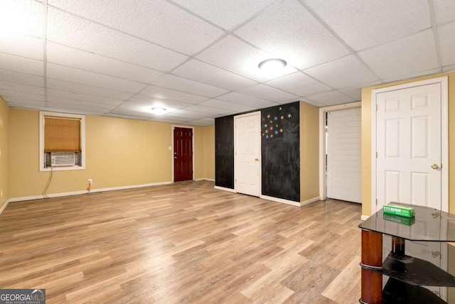 1055 River Bluff Dr, Winder, GA 30680 - finished basement with cooling unit, light wood finished floors, baseboards, and a drop ceiling