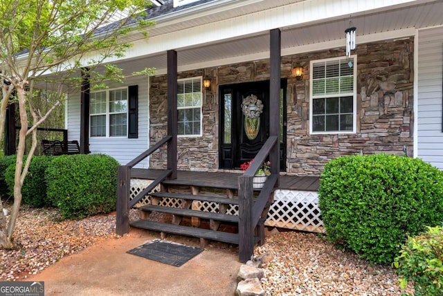 1055 River Bluff Dr, Winder, GA 30680 - property entrance with a porch and stone siding
