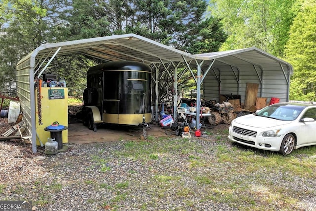 1055 River Bluff Dr, Winder, GA 30680 - view of vehicle parking featuring a detached carport