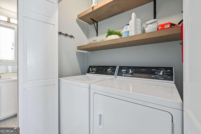 laundry area with washer and dryer, laundry area, and a sink