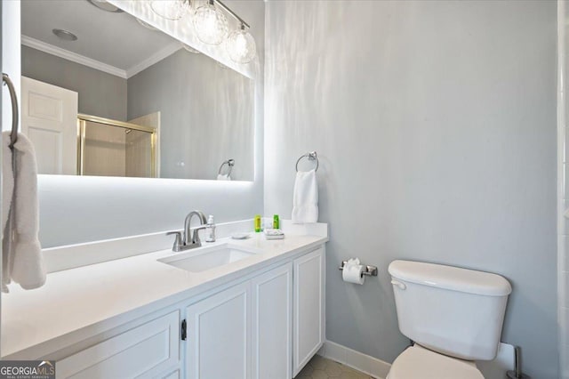 full bath featuring toilet, a stall shower, baseboards, vanity, and ornamental molding