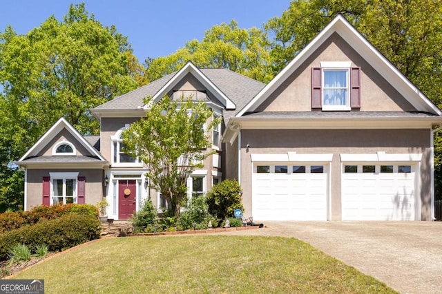 4016 Upland Trce, Marietta, GA 30066 - view of front of property with concrete driveway, stucco siding, and a front yard
