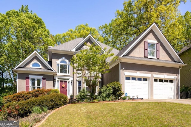 4016 Upland Trce, Marietta, GA 30066 - view of front facade with driveway, stucco siding, and a front lawn