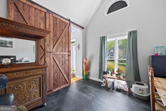 4016 Upland Trce, Marietta, GA 30066 - entryway featuring high vaulted ceiling, baseboards, and a barn door