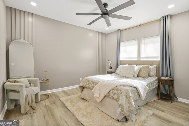 bedroom with baseboards, recessed lighting, and wood finished floors