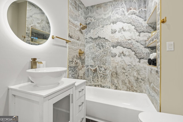 bathroom with toilet, shower / bath combination, and vanity