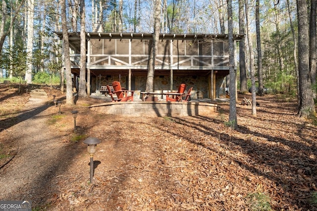 view of front facade with a sunroom