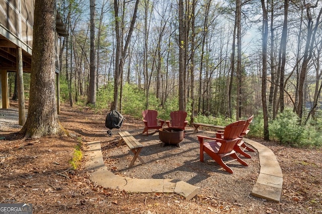view of patio with a fire pit