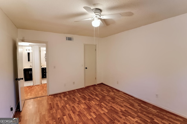 1181 Church St Unit D, Decatur, GA 30030 - unfurnished bedroom with wood finished floors and a ceiling fan