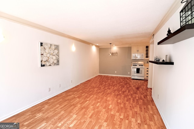 1181 Church St Unit D, Decatur, GA 30030 - unfurnished living room featuring light wood-style floors and ornamental molding