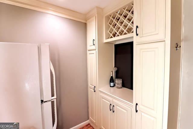 1181 Church St Unit D, Decatur, GA 30030 - kitchen featuring freestanding refrigerator, light countertops, and white cabinets