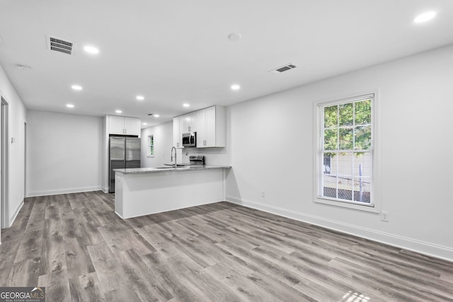 849 Wood St NW, Atlanta, GA 30318 - kitchen featuring recessed lighting, visible vents, appliances with stainless steel finishes, and a sink