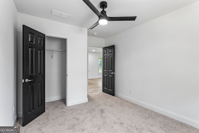 849 Wood St NW, Atlanta, GA 30318 - unfurnished bedroom featuring baseboards, carpet flooring, visible vents, and a closet